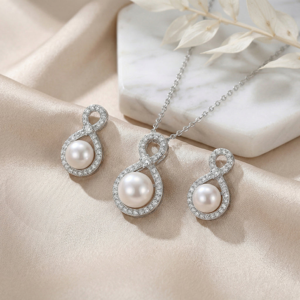 Ivory Pearl Infinity Set detail — infinity band and pearl close-up, House of Ugarit